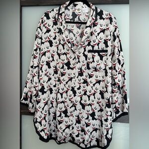 100% silk,machine wash, Disney oversized size M 23”ptp. Covered buttons.